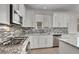 Well-equipped kitchen with modern appliances and stylish backsplash details at 348 Andy Wheeler Dr, Henderson, NV 89011