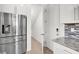 Close-up of kitchen with stainless steel refrigerator and access to another room at 348 Andy Wheeler Dr, Henderson, NV 89011