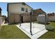 Well-maintained backyard with patio, pergola, artificial grass, and a storage shed at 4104 Free Bird Crest Ave, North Las Vegas, NV 89081
