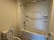 Bathroom with tub and shower combination, toilet and tiled floor at 4104 Free Bird Crest Ave, North Las Vegas, NV 89081