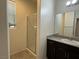 Bathroom with a shower, granite countertop vanity, and window at 4104 Free Bird Crest Ave, North Las Vegas, NV 89081