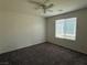 Neutral bedroom with carpet, ceiling fan and a window bringing in natural light at 4104 Free Bird Crest Ave, North Las Vegas, NV 89081
