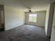Bedroom featuring a ceiling fan, window and carpet flooring at 4104 Free Bird Crest Ave, North Las Vegas, NV 89081
