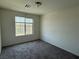 Carpeted bedroom with a window providing natural light and a view of the outdoors at 4104 Free Bird Crest Ave, North Las Vegas, NV 89081