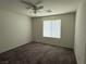 Neutral bedroom with carpet, ceiling fan and a window bringing in natural light at 4104 Free Bird Crest Ave, North Las Vegas, NV 89081
