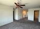 Bonus room with carpet flooring, ceiling fan and access to the bathroom at 4104 Free Bird Crest Ave, North Las Vegas, NV 89081