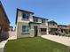 Charming two story home with a two car garage, driveway, and low maintenance artificial grass yard at 4104 Free Bird Crest Ave, North Las Vegas, NV 89081