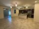 Open concept floor plan with a kitchen featuring an island and stainless steel appliances at 4104 Free Bird Crest Ave, North Las Vegas, NV 89081