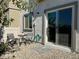 Private backyard area with a small patio set on gravel, adjacent to the sliding glass door, for a cozy outdoor experience at 4273 Venus Falls Ave, North Las Vegas, NV 89084