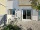 Landscaped backyard with a small patio and chairs, perfect for outdoor relaxation with a nice view at 4273 Venus Falls Ave, North Las Vegas, NV 89084