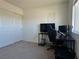 Bedroom featuring a desk, a chair, a closet, and a large window with lots of light at 4273 Venus Falls Ave, North Las Vegas, NV 89084