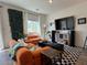 Cozy living room featuring a large window, modern decor, and lots of natural light at 4273 Venus Falls Ave, North Las Vegas, NV 89084
