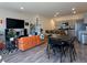 Open-concept living area featuring modern furnishings, a kitchen island, and sleek countertops at 4273 Venus Falls Ave, North Las Vegas, NV 89084