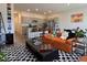 Bright living room with an open floor plan that showcases the kitchen at 4273 Venus Falls Ave, North Las Vegas, NV 89084