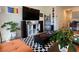 Stylishly decorated living room with pops of color, modern decor, and lots of plants at 4273 Venus Falls Ave, North Las Vegas, NV 89084