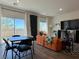A sun-drenched living area showcases large windows, modern furniture and stylish decor at 4273 Venus Falls Ave, North Las Vegas, NV 89084