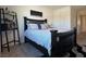 Main bedroom featuring a bed, a side table and stylish shelves at 4273 Venus Falls Ave, North Las Vegas, NV 89084