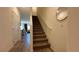Interior stairway featuring carpeted steps, white banister, and a round mirror on the wall at 4273 Venus Falls Ave, North Las Vegas, NV 89084