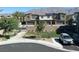 Exterior street view featuring a modern home with a well-kept lawn, benches and garage parking at 4273 Venus Falls Ave, North Las Vegas, NV 89084
