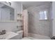 Clean bathroom featuring updated vanity and fixtures, a shower with tile, and stylish shelving at 4831 Vermont Ave, Las Vegas, NV 89107