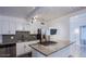 Modern kitchen with stainless steel appliances, granite countertops, and ample cabinet space at 4831 Vermont Ave, Las Vegas, NV 89107
