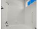 Bright, clean bathroom shower with white tile and accessible grab bars at 5155 W Tropicana Ave # 2017, Las Vegas, NV 89103