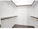 Organized walk-in closet with multiple shelves and hanging rods at 5155 W Tropicana Ave # 2017, Las Vegas, NV 89103