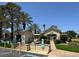 West Trop Condos community clubhouse surrounded by mature landscaping and palm trees at 5155 W Tropicana Ave # 2017, Las Vegas, NV 89103
