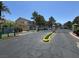 The community entrance gate for the West Trop Condos community with lush landscaping at 5155 W Tropicana Ave # 2017, Las Vegas, NV 89103
