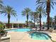 Sparkling community pool and spa area featuring ample seating and lush landscaping, all framed by towering palm trees at 5155 W Tropicana Ave # 2017, Las Vegas, NV 89103