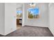 Dining room area view showing plush carpeting, bright windows and a view of the kitchen at 5155 W Tropicana Ave # 2017, Las Vegas, NV 89103