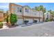 Condominium building exterior shows multi-car garages with low-maintenance desert landscaping at 5155 W Tropicana Ave # 2017, Las Vegas, NV 89103