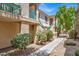 Beautiful condo exterior features colorful desert landscaping and building architecture at 5155 W Tropicana Ave # 2017, Las Vegas, NV 89103