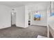Large living room featuring plush carpet, view of the kitchen and fireplace at 5155 W Tropicana Ave # 2017, Las Vegas, NV 89103
