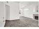 Bright, open living room with fireplace, ceiling fan and plush carpeting at 5155 W Tropicana Ave # 2017, Las Vegas, NV 89103