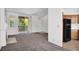 Spacious living room featuring neutral carpet, access to balcony, and convenient access to the kitchen at 5155 W Tropicana Ave # 2017, Las Vegas, NV 89103