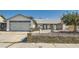 A charming single-story home with attached two-car garage and concrete block fence at 5368 Regal Ave, Las Vegas, NV 89146