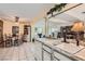 Open floor plan kitchen with white appliances, granite countertops, and access to dining area at 5368 Regal Ave, Las Vegas, NV 89146