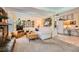Open living room flows into kitchen and features a stone fireplace, perfect for entertaining at 5368 Regal Ave, Las Vegas, NV 89146