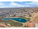 Community aerial view of the area, showcasing lake, golf course and neighborhood at 5458 Walton Heath Ave, Las Vegas, NV 89142