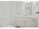Clean bathroom with a white vanity, new fixtures, and ample lighting, creating a refreshing space at 5458 Walton Heath Ave, Las Vegas, NV 89142