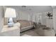 Staged primary bedroom with neutral tones and a view into the bathroom at 5458 Walton Heath Ave, Las Vegas, NV 89142