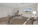 Staged bedroom featuring a large window, carpet, and furniture at 5458 Walton Heath Ave, Las Vegas, NV 89142