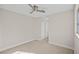 Cozy bedroom with carpet flooring, closet with sliding doors and a ceiling fan at 5458 Walton Heath Ave, Las Vegas, NV 89142