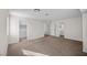 Spacious carpeted bedroom with a walk-in closet and a bathroom at 5458 Walton Heath Ave, Las Vegas, NV 89142