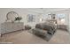 Staged bedroom with a large bed, dresser, and stylish decor at 5458 Walton Heath Ave, Las Vegas, NV 89142