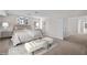 Staged bedroom featuring a luxurious bed and neutral décor for a serene atmosphere at 5458 Walton Heath Ave, Las Vegas, NV 89142