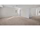 Large carpeted bedroom featuring a neutral color scheme and two closets at 5458 Walton Heath Ave, Las Vegas, NV 89142