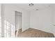 Cozy bedroom showcases plank flooring, a closet, and neutral walls, offering a serene retreat at 5458 Walton Heath Ave, Las Vegas, NV 89142