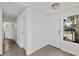 Inviting entryway boasting plank floors, access to a laundry room, and a secure front door at 5458 Walton Heath Ave, Las Vegas, NV 89142